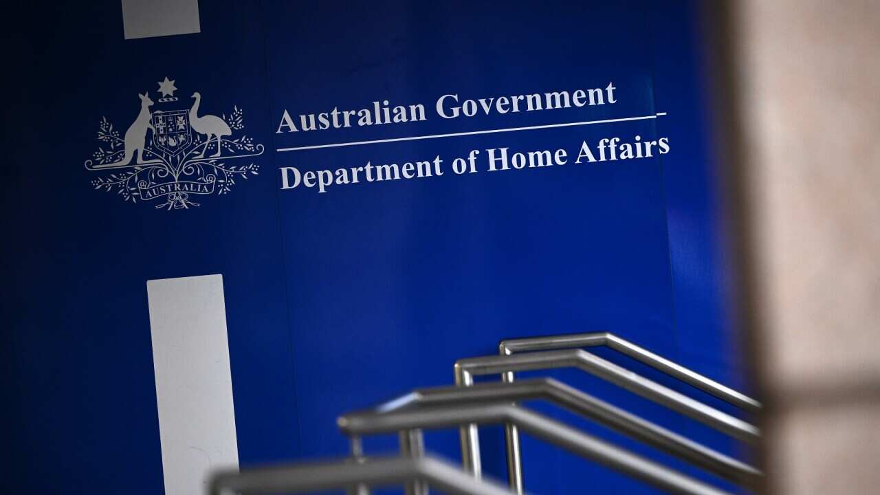 REFUGEES RALLY FOR PERMANENT VISAS