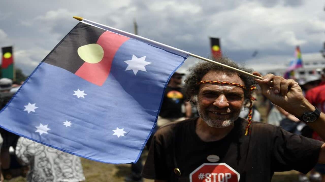 A man at an Australia Day protest at the Aboriginal Tent Embassy