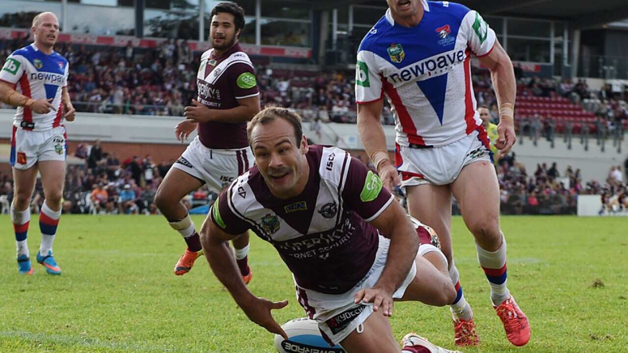 Brett Stewart of the Sea Eagles scores a try.