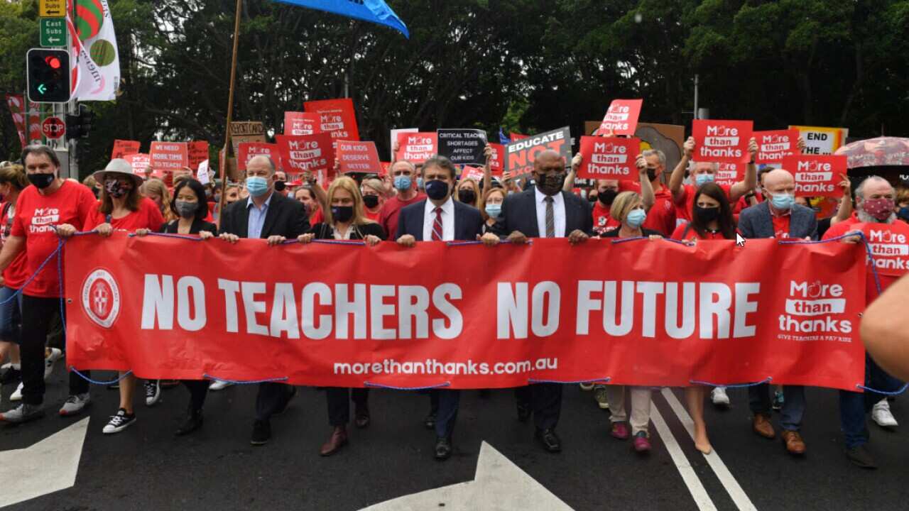 Teachers march on Parliament House during a strike by NSW public school teachers and principals in Sydney, Tuesday, 7 December, 2021.