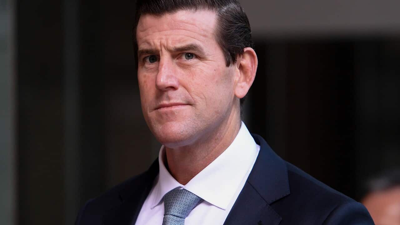 A photo of Ben Roberts-Smith in a suit outside court