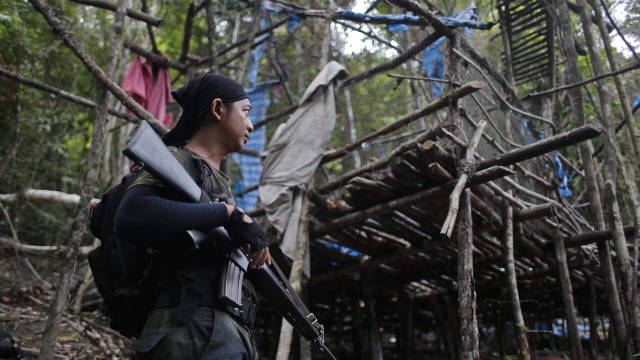 Malaysian police investigate forest and border officials for possible involvement in the trafficking of migrants, following the discovery of 139 graves in a reserve near the Thai border