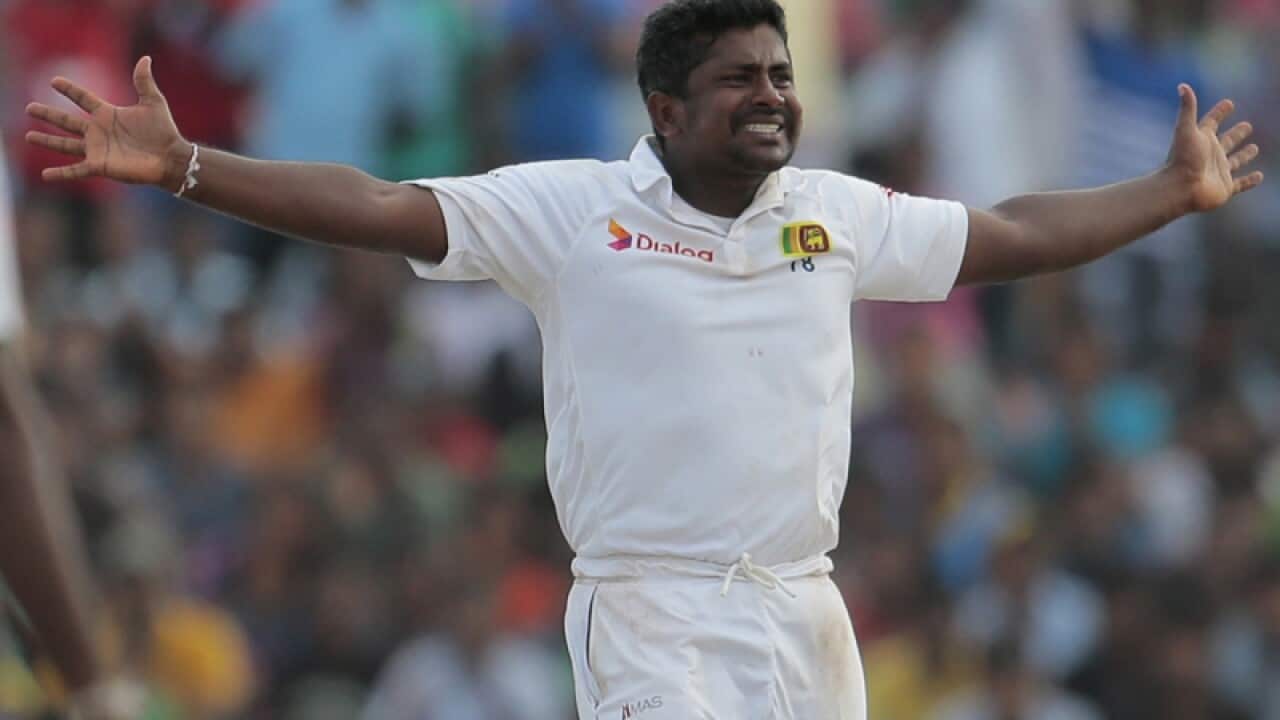 Sri Lankan bowler Rangana Herath successfully appeals to dismiss Pakistan's Junaid Khan during the fifth day of the first test cricket match in Galle, Sri Lanka, Sunday, Aug. 10, 2014. (AP Photo/Eranga Jayawardena)