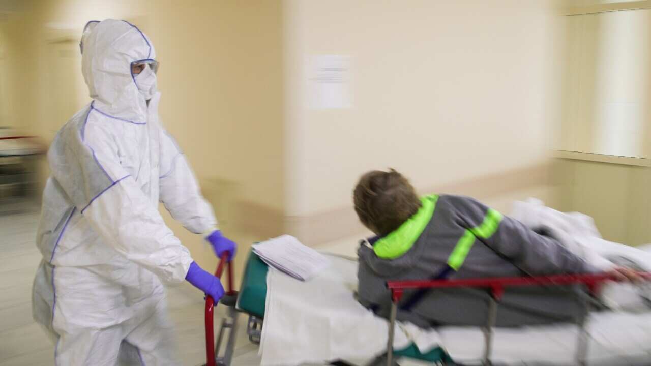 An employee and a patient at the Federal Clinical Center of Higher Medical Technologies in Moscow.