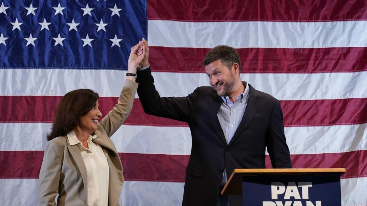 Democratic candidate Pat Ryan (right) and New York Governor Kathy Hochul appear on stage together during a campaign rally on 22 August in Kingston, New York.