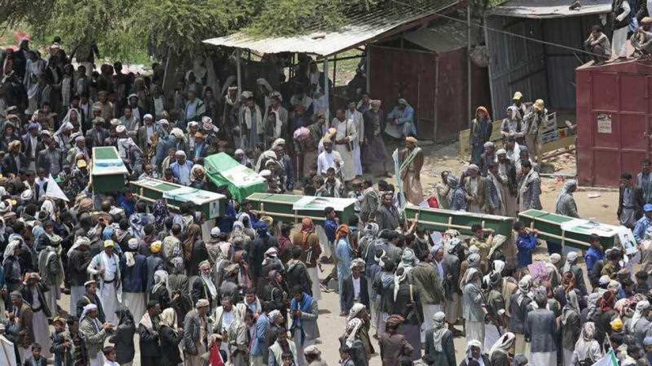 Yemeni people carry the coffins of victims of a Saudi-led airstrike, during a funeral in Saada, Yemen, Monday, Aug. 13, 2018.