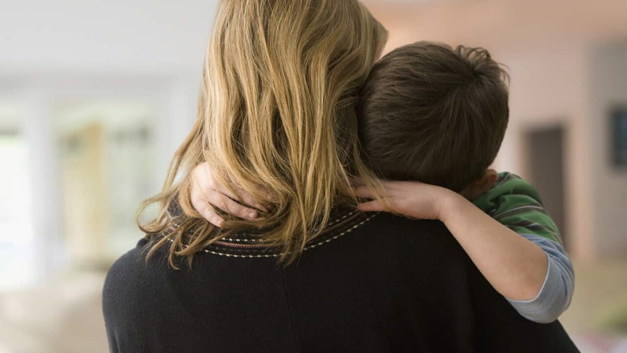 Caucasian mother comforting son