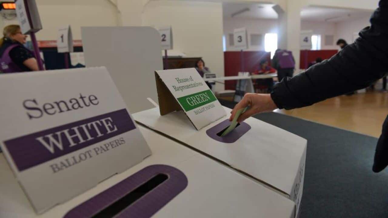 People cast their votes at a polling station