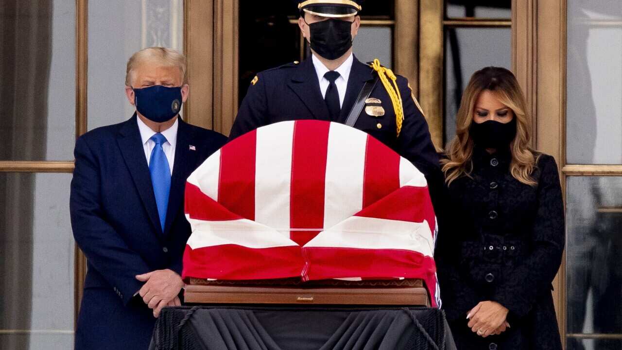 US President Donald Trump and First Lady Melania Trump view the flag-draped casket of late US Supreme Court Justice Ruth Bader Ginsburg in Washington, DC.