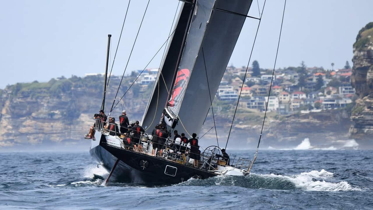 LDV Comanche passes South Head during a practice sail ahead of the Sydney to Hobart, which starts on Boxing Day.