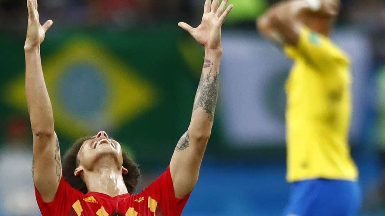 Belgium's Axel Witsel, centre celebrates after the final whistle as Belgium defeat Brazil in their quarterfinal match between Brazil and Belgium at the 2018 soccer World Cup in the Kazan Arena.