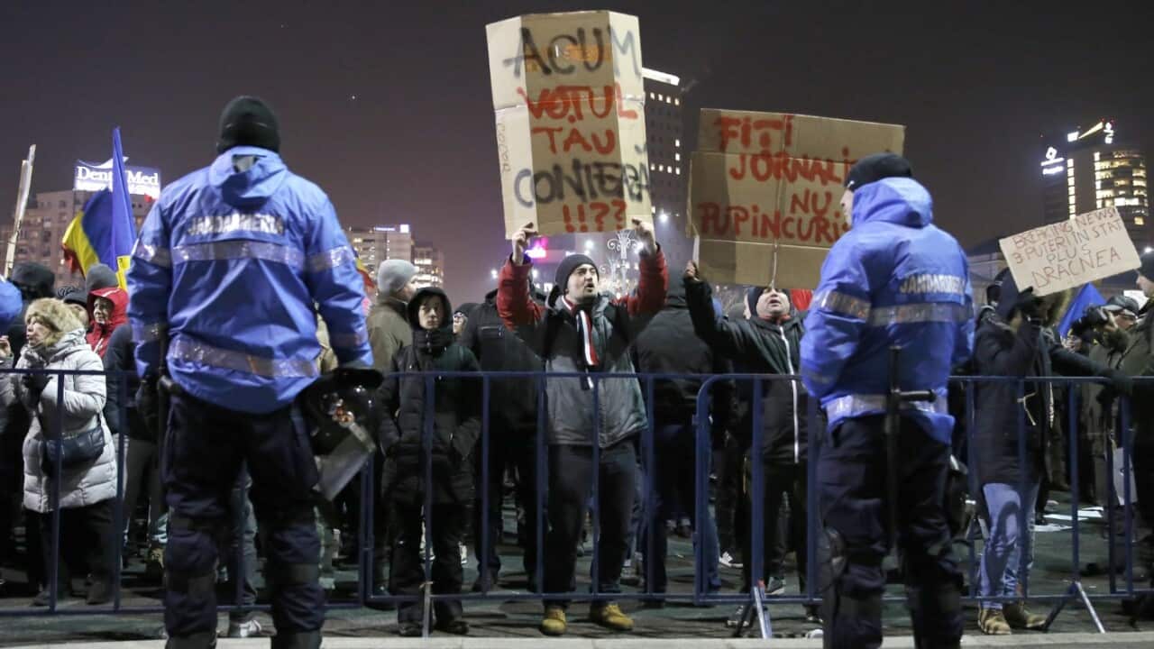 People wave placards and shout anti-government slogans during a protest rally in front of government headquarters in Bucharest, Romania, 01 February 2017.