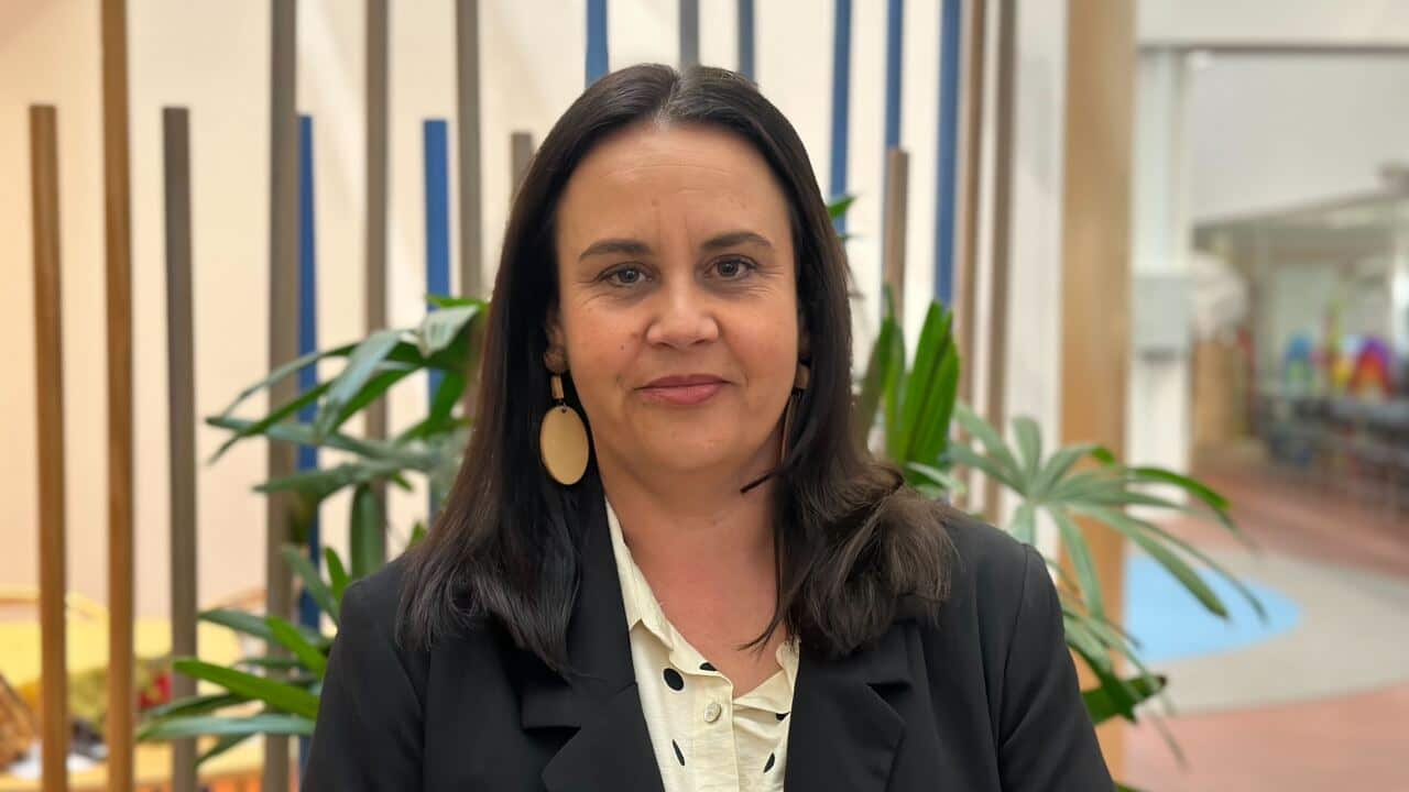 a woman wearing a black jacket