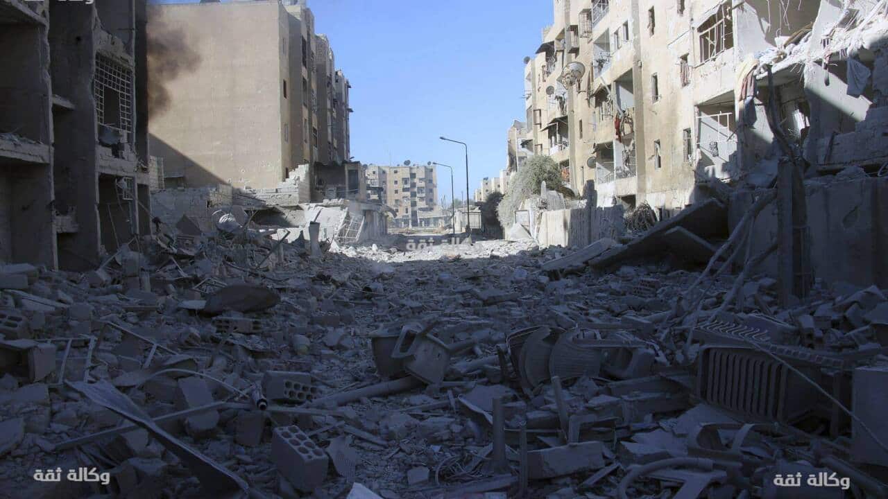 damaged buildings after airstrikes hit the Al-Shaar neighborhood of Aleppo, Syria