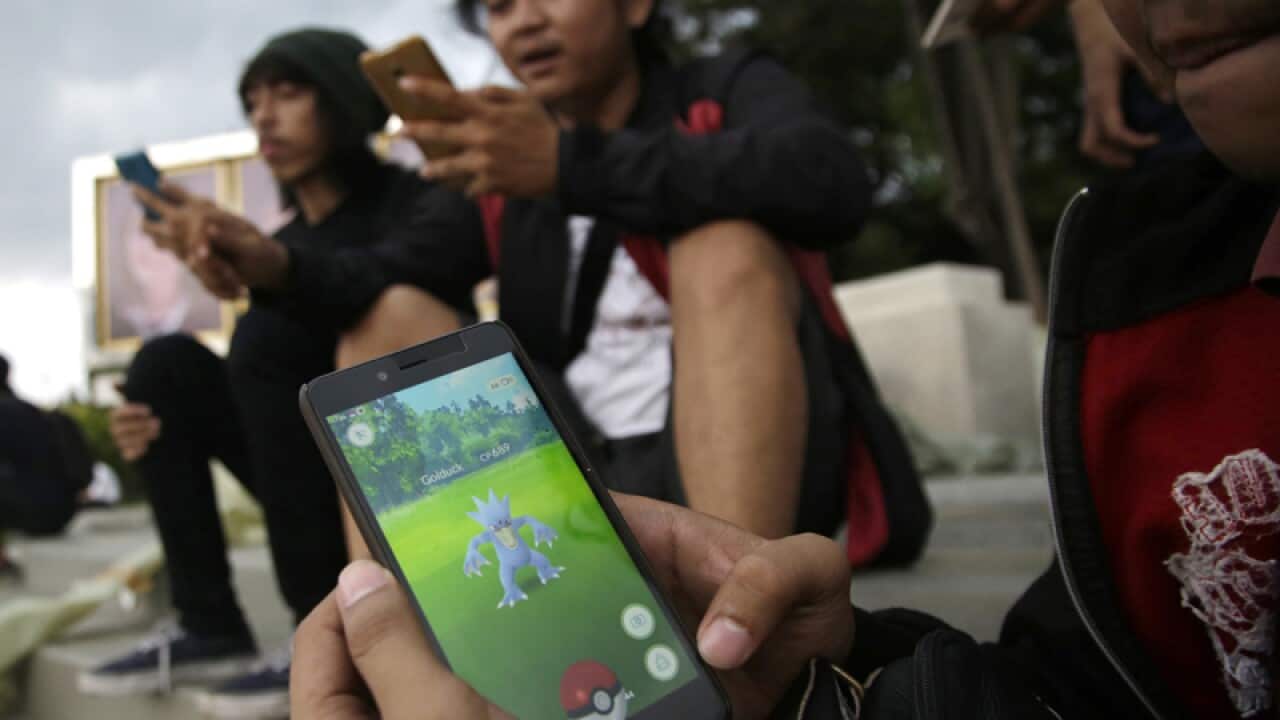 Indonesians play smartphone app Pokemon Go