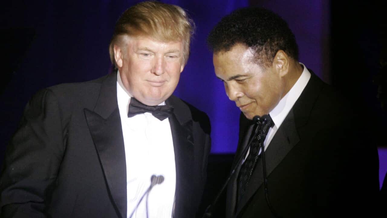 In this March 24, 2007, file photo, Donald Trump, left, accepts his Muhammad Ali award from Ali at Muhammad Ali's Celebrity Fight Night XIII in Phoenix