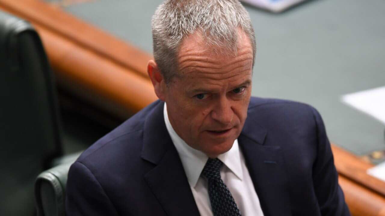 Opposition Leader Bill Shorten reacts in parliament
