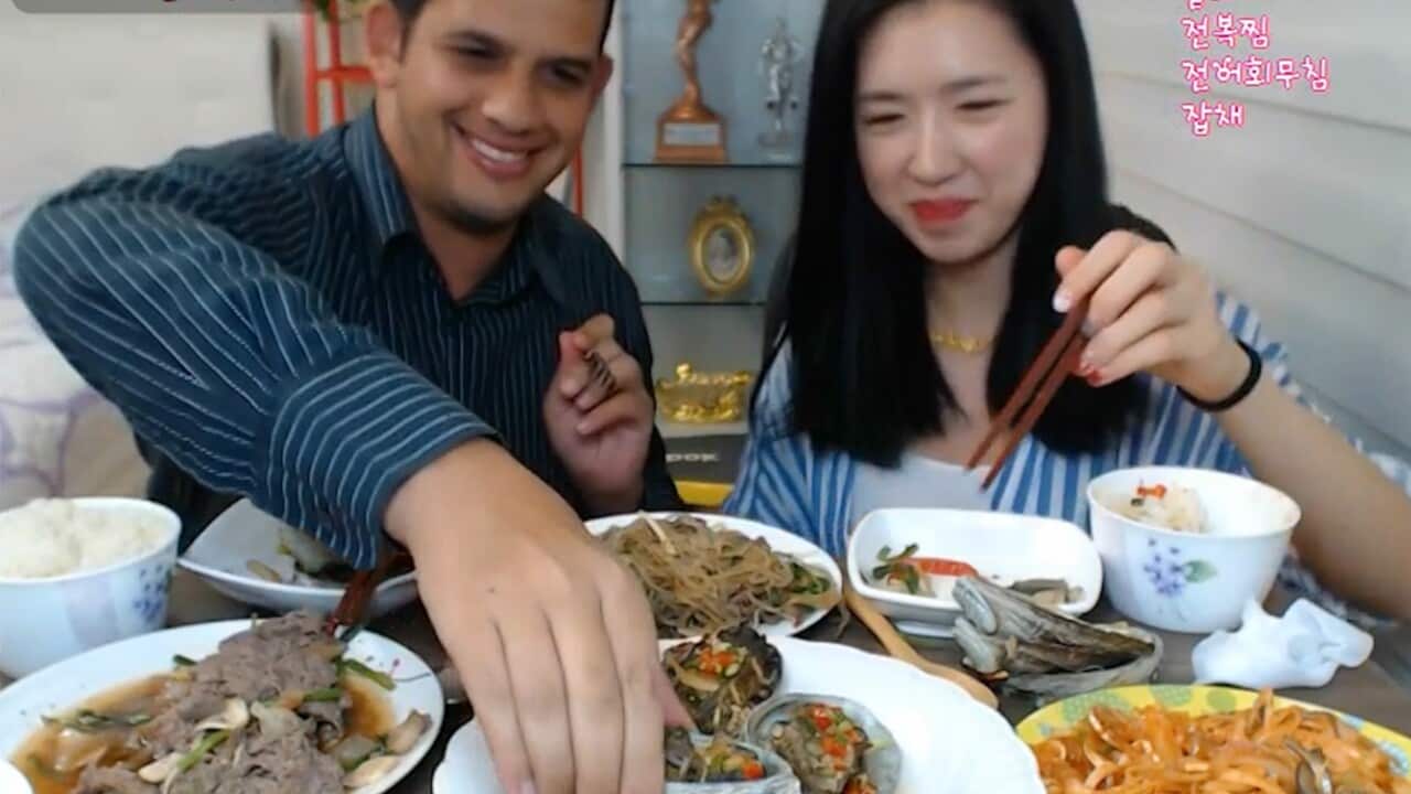 Drew and BJ Fitness Fairy eat their way through a huge feast while fans watch via her webcam.
