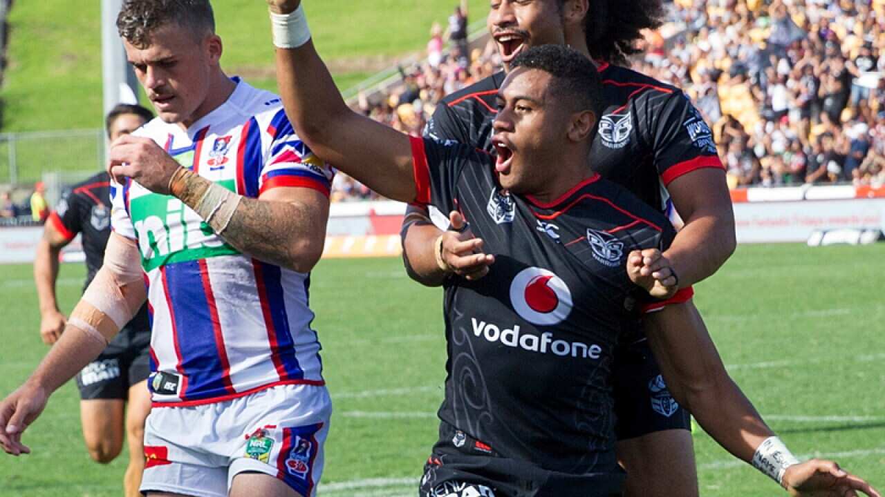 David Fusitu`a of the Warriors celebrates scoring a try