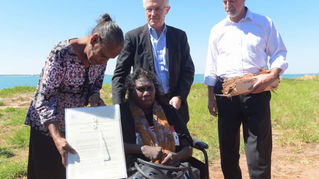Malcolm Turnbull handing over the Kenbi land claim title deed