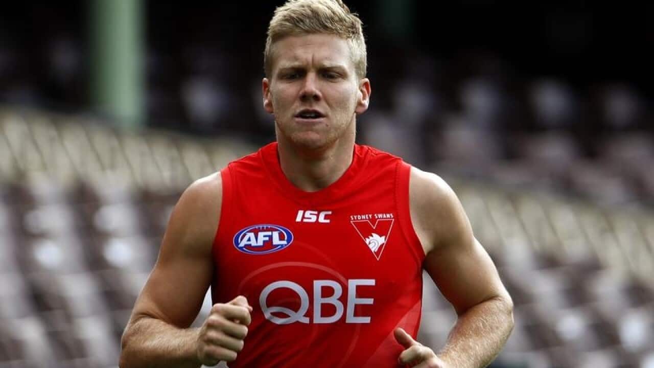 Dan Hannebery of the Swans runs during a training session.