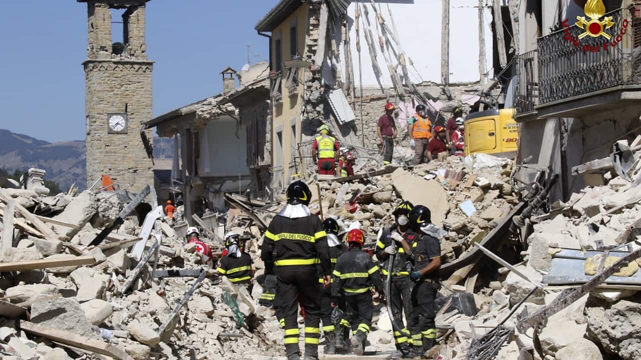 Rescuers work amid collapsed building in Amatrice, central Italy (AAP)