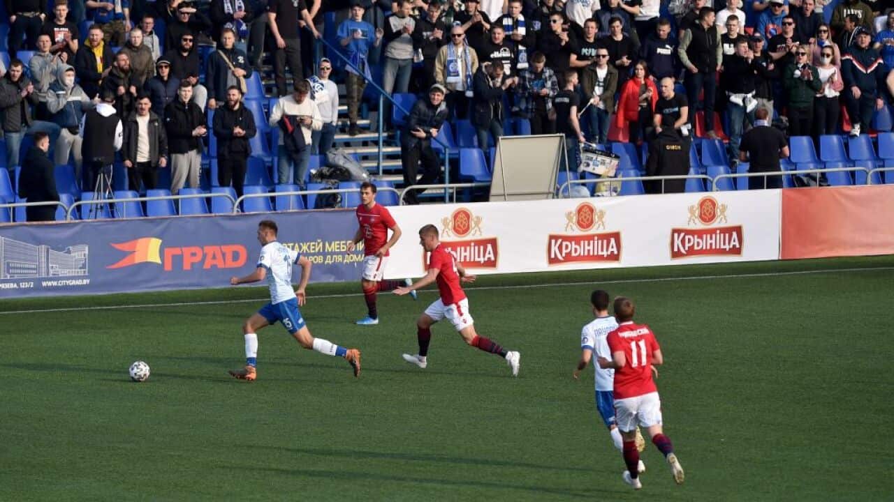 FC Minsk and FC Dinamo-Minsk team players vie for the ball during the Belarus Championship football match in Minsk