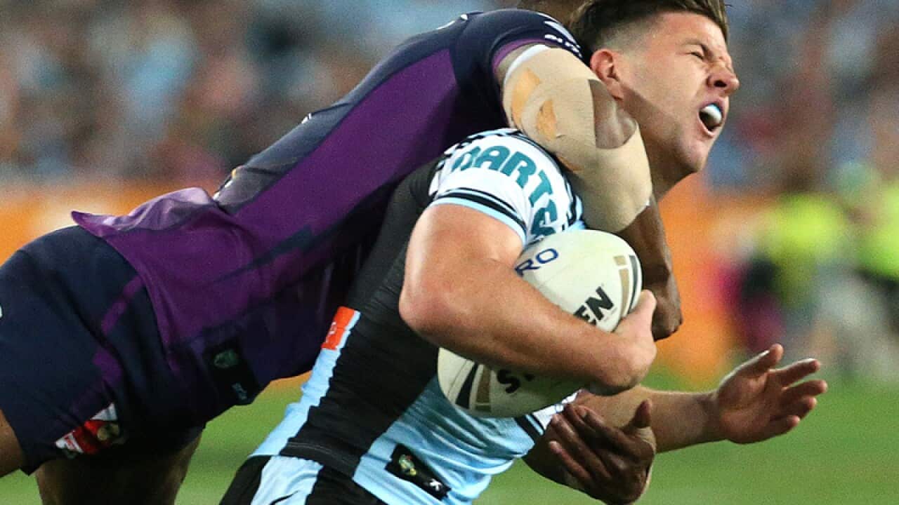 Chad Townshend (R) is tackled by Marika Koroibete