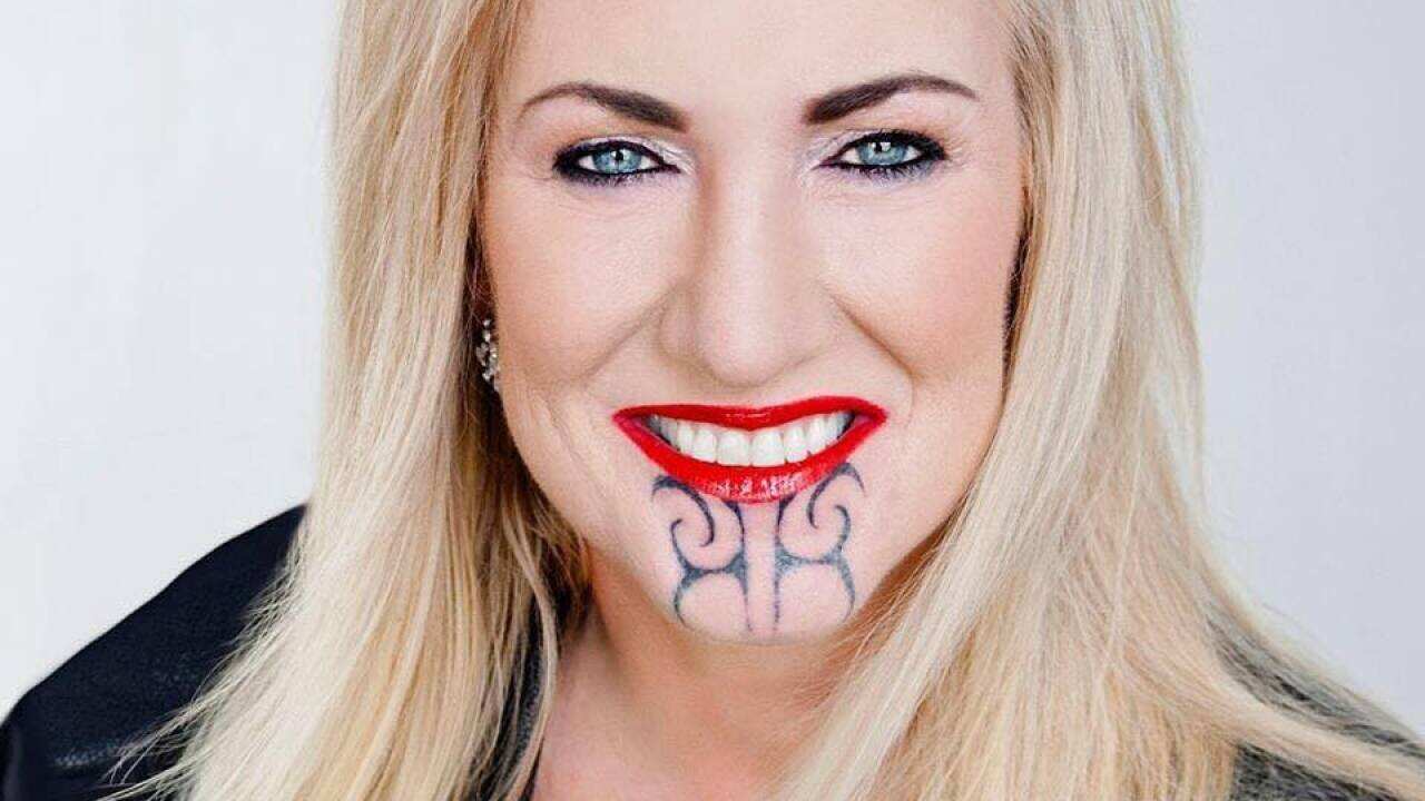 kiwi woman creates cultural appropriation furore over chin tattoo