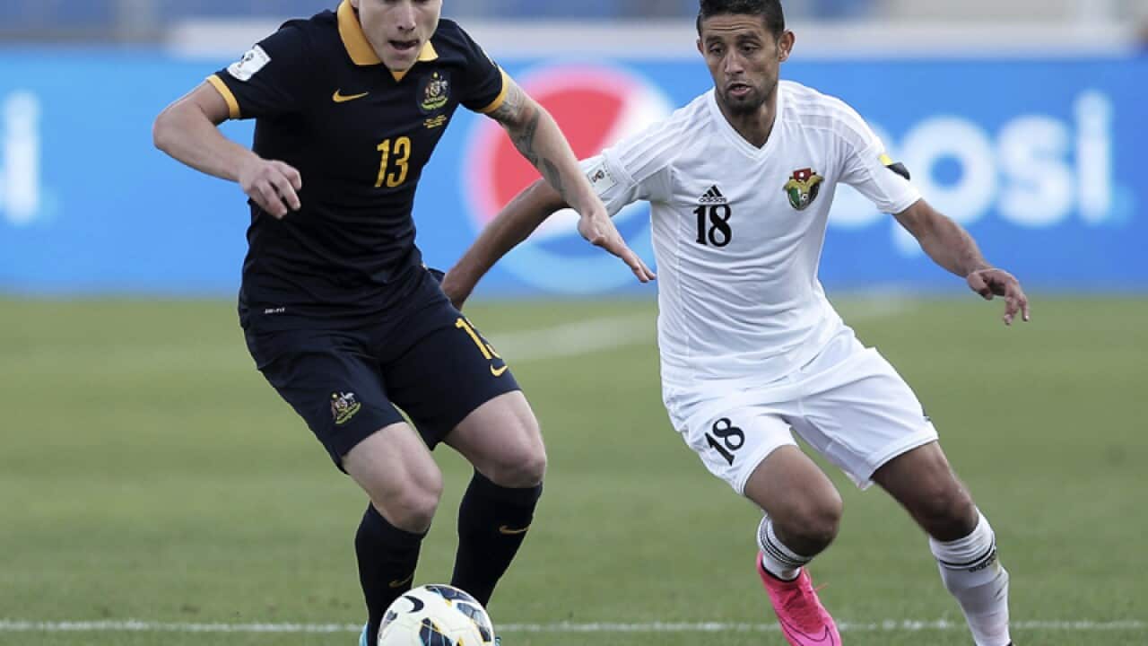 Australia's Aaron Mooy (L) and Jordan's Hasan Abdel Fattah