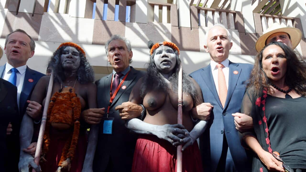 Bill Shorten and Malcolm Turnbull link arms with aboriginal elders