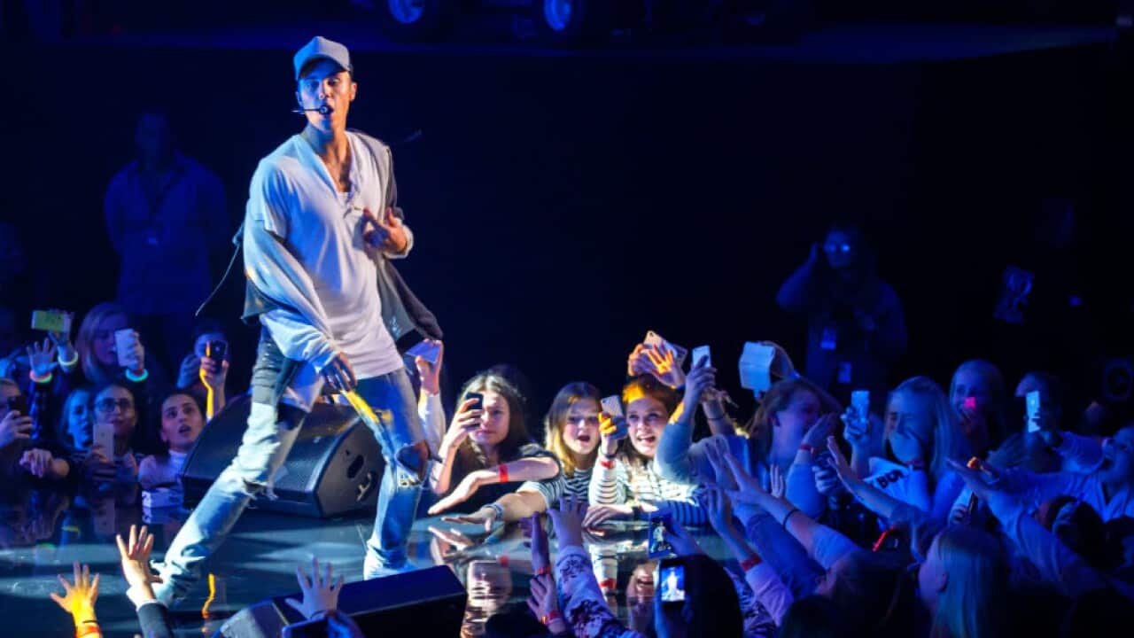 Singer Justin Bieber on stage during a concert in Oslo, Thursday Oct. 29, 2015. Bieber says he stopped a concert in Oslo after one song Thursday because fans got in his way as he tried to wipe up liquid on stage.