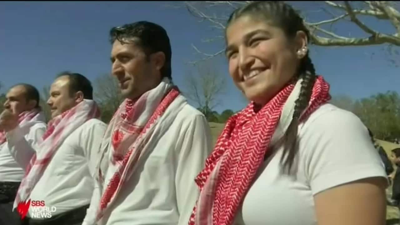 Yazidi refugees take part in Toowoomba's multicultural festival.