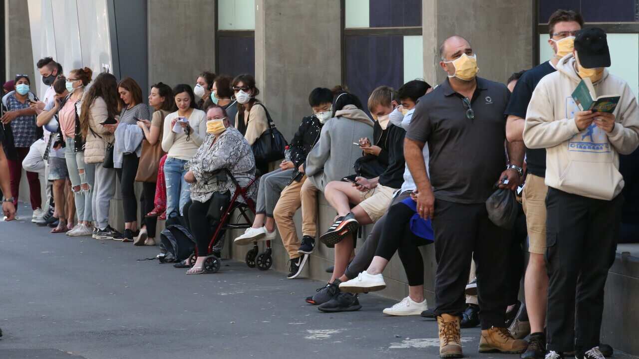 Patients line up at the Royal Melbourne Hospital for Coronavirus testing.