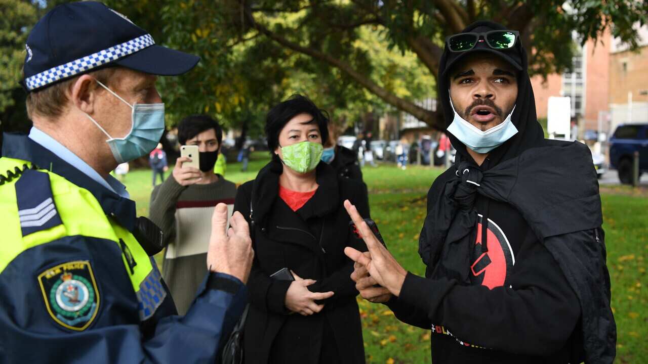 Paul Silva (right), nephew of David Dungay Jr, and Greens MP Jenny Leong (centre) speak with NSW Police.