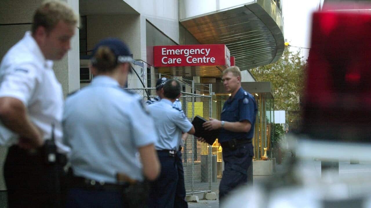 Melbourne, May 7, 2002. Police begin investigations at St.Vincents Hospital where a man was shot dead this afternoon. The man, a prisoner under-going medical treatment was shot whilst trying to escape. (AAP Image/Julian Smith) NO ARCHIVING