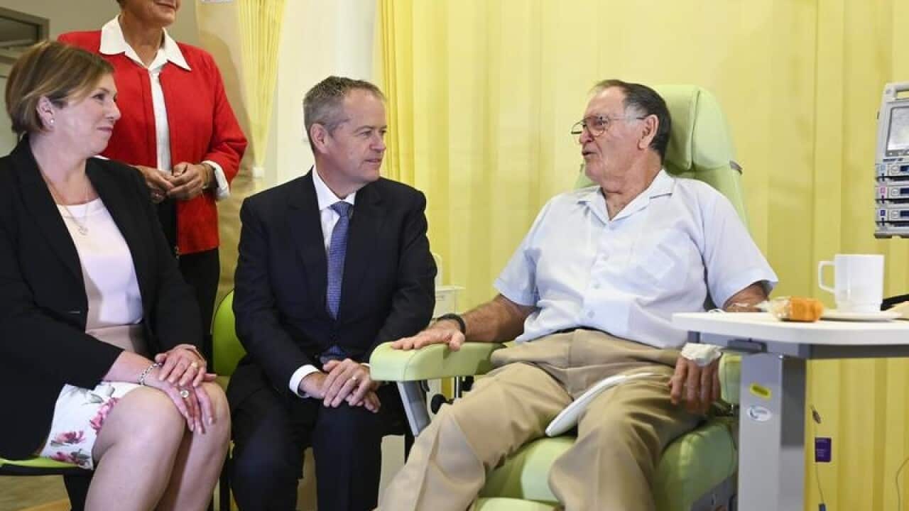 Bill Shorten talking to a cancer patient.