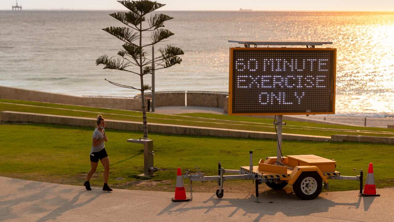A sign stating '60 minutes exercise only' is seen at Scarborough Beach in Perth, Monday, 1 February, 2021.