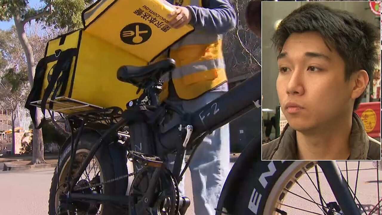 Kiet is a delivery rider for Easi. (SBS News)