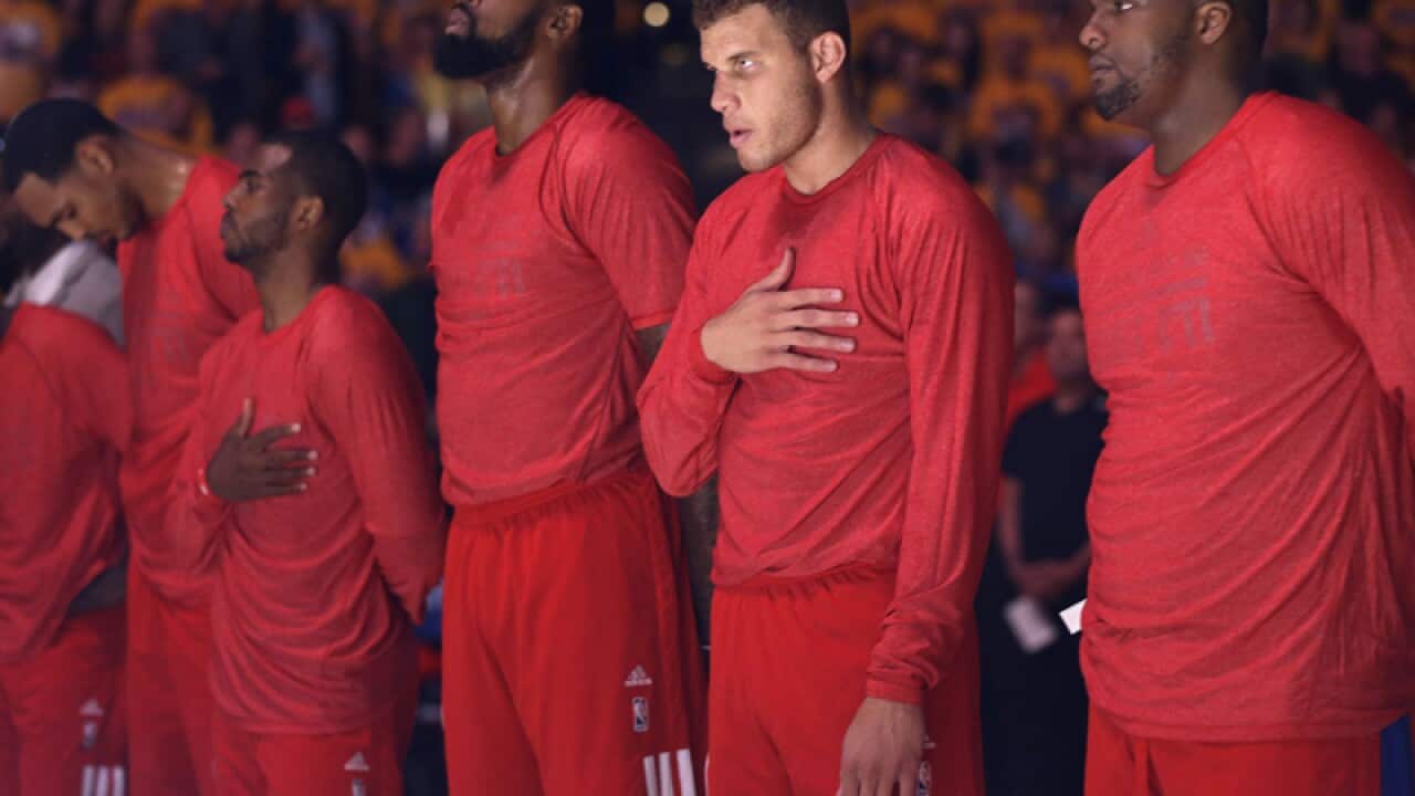 Los Angeles Clippers players wear their warmup jerseys inside out