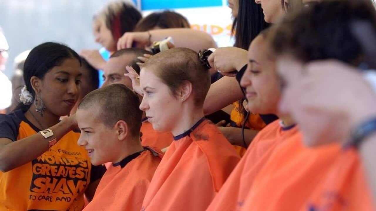People have their heads shaved at the World's Greatest Shave