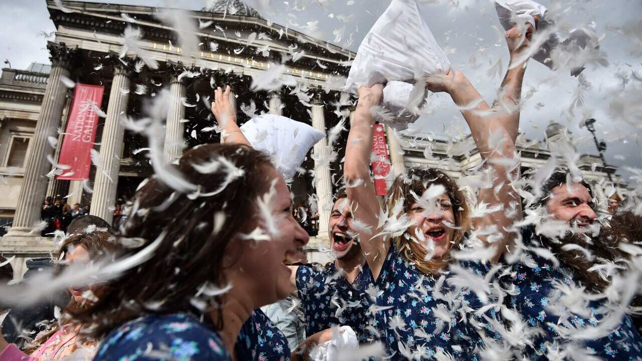 Revellers take part in a mass pillow fight in Trafalgar Square in central London on April 5, 2014 on International Pillow Fight Day. AFP PHOTO / BEN STANSALL (Photo credit should read BEN STANSALL/AFP/Getty Images)