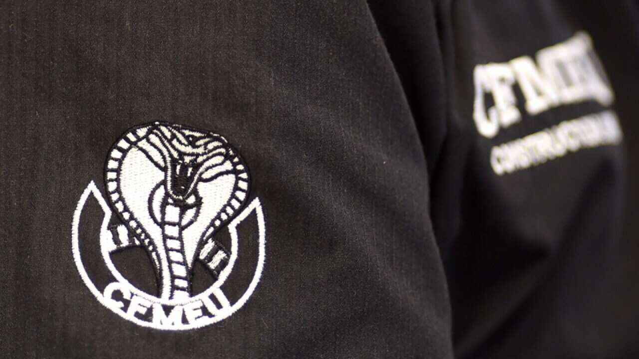 A CFMEU logo is seen on a workers shirt in Canberra