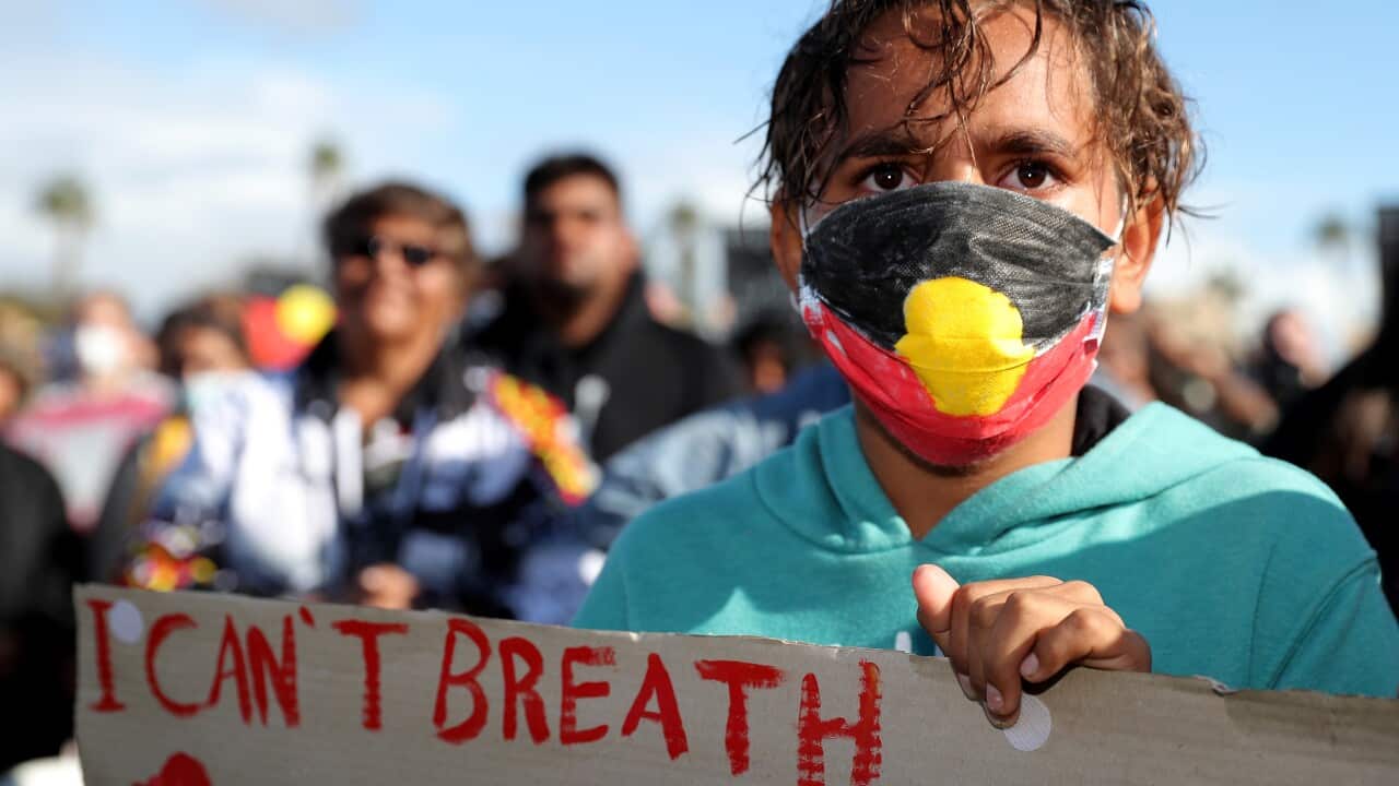 Protesters participate in a Black Lives Matter rally at Langley Park in Perth, Saturday, June 12, 2020. The protest is to raise awareness of Aboriginal Deaths in Custody. (AAP Image/Richard Wainwright) NO ARCHIVING
