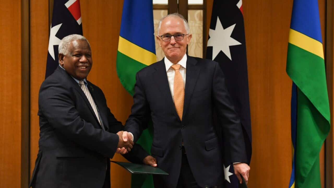 Solomon Islands Prime Minister Rick Houenipwela (left) and Prime Minister Malcolm Turnbull