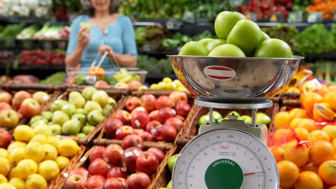 Woman shopping for fruit