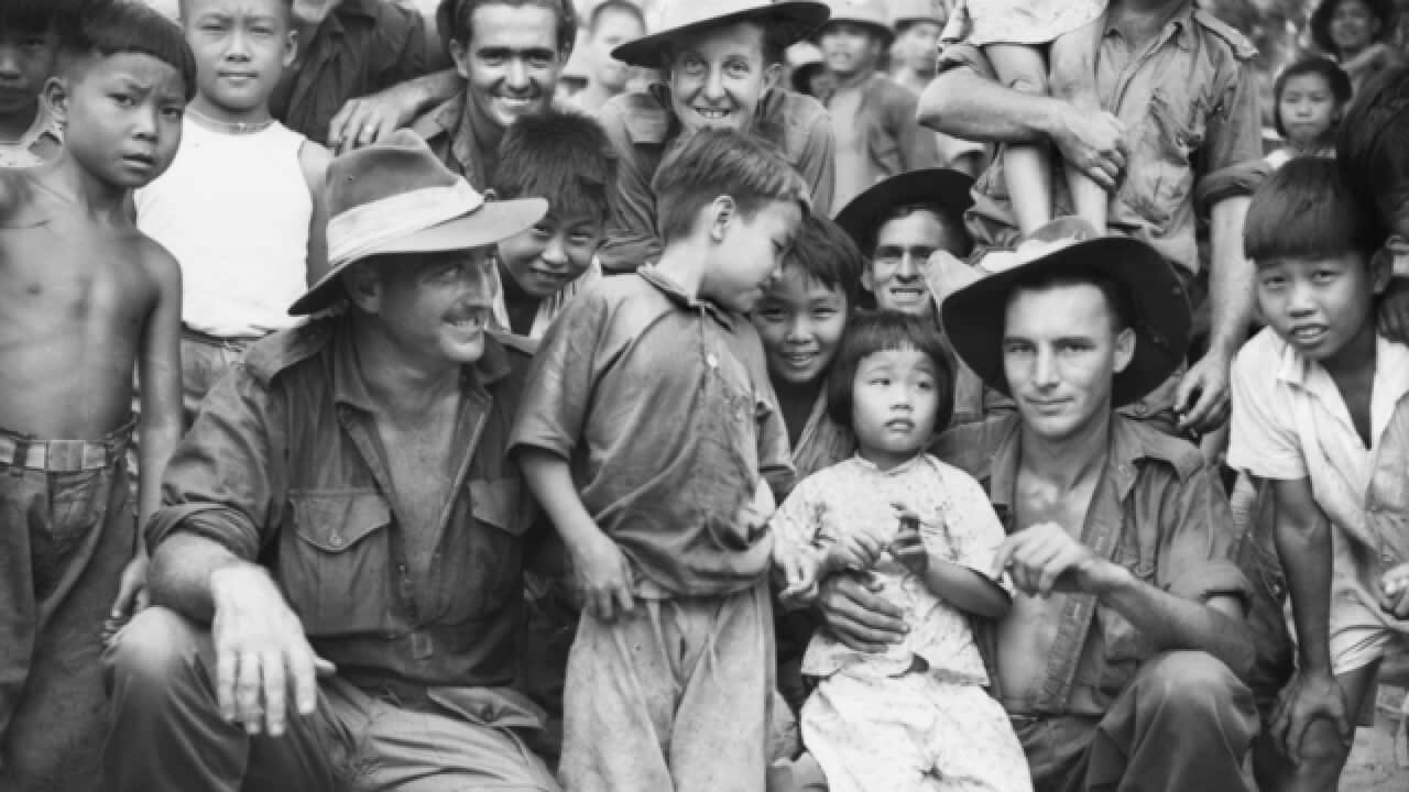 Liberated prisoners of a Japanese civilian labour camp called Ratongor in New Guinea