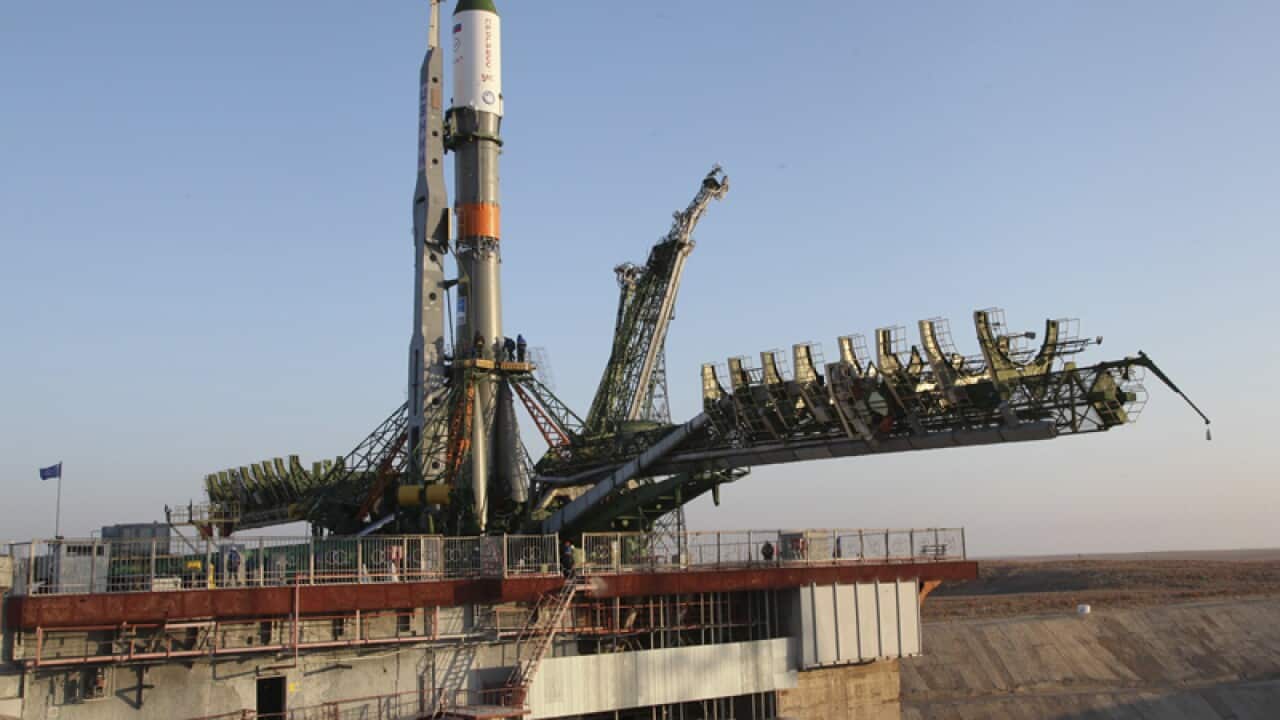The Soyuz-FG rocket booster with the Progress MS-04 cargo ship