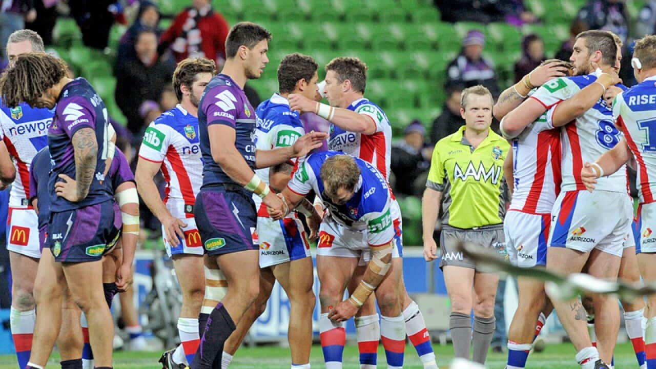 Knights Players celebrate their win over Melbourne Storm
