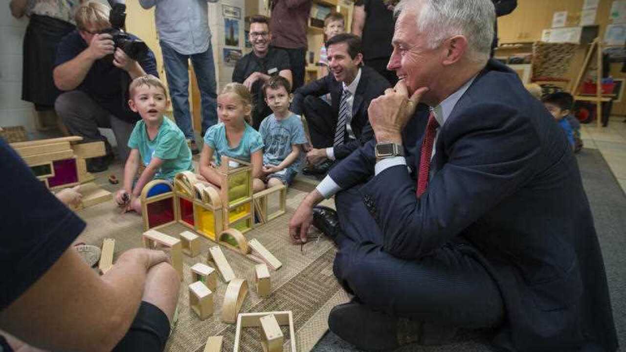 PM Malcolm Turnbull shares some creative playtime with child care children during his visit to Mooringe World of Learning Child Care Centre